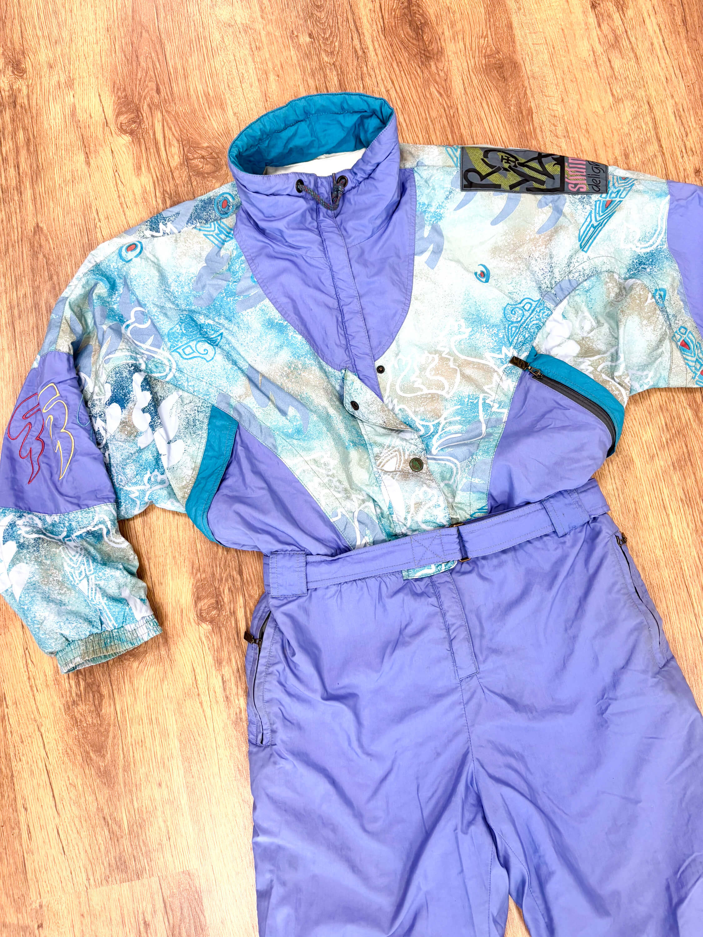 Vintage retro skipak - Virage lila, turquoise met print maat L